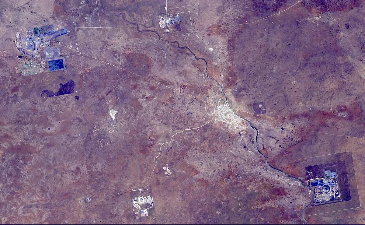 Satellite image of the Orapa mine area with pits and tailings in desert scrub